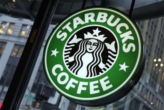 A sign in a Starbucks is displayed in New York's Times Square. Starbucks it will have packages of its Keurig coffee pods available at U.S. grocery stores and specialty retailers beginning in November.